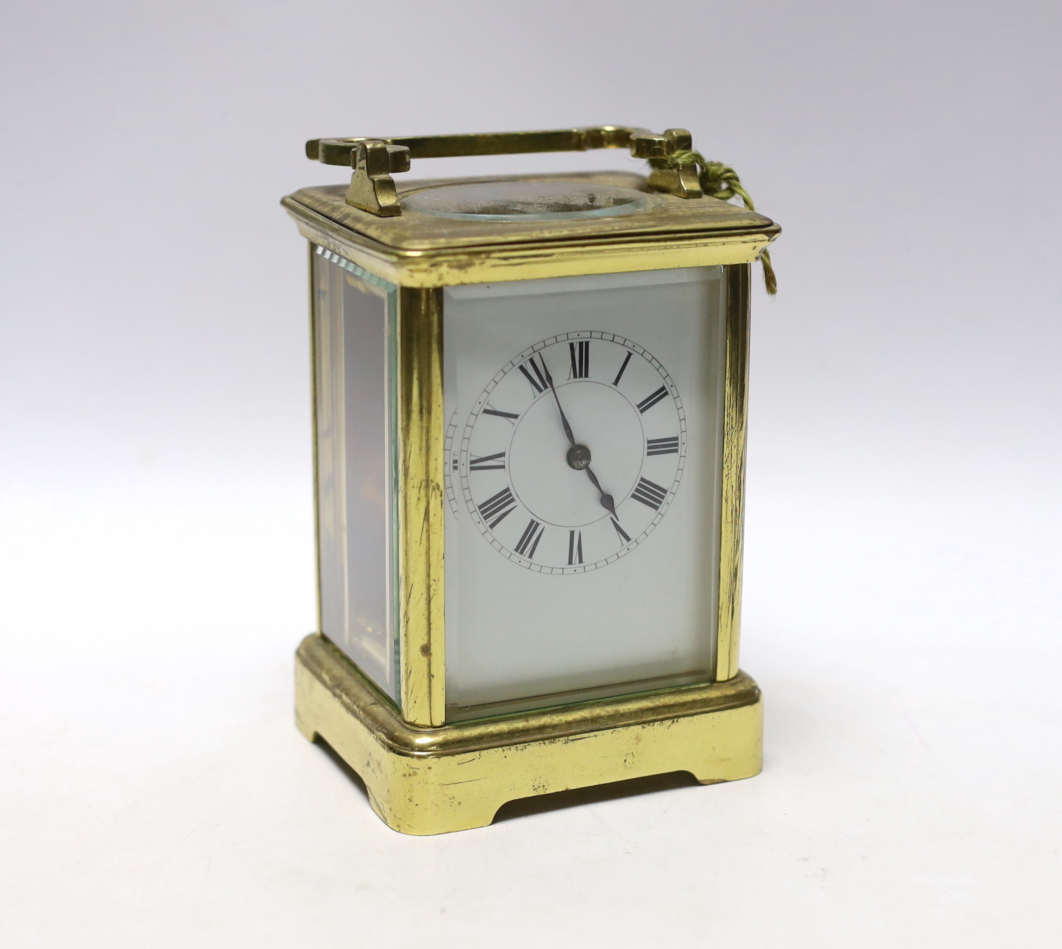 A brass carriage timepiece with enamel dial, 18cm high